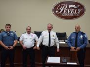 Four officers standing at podium